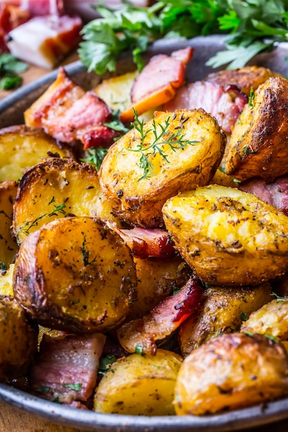 american roasted potatoes with smoked bacon garlic salt pepper cumin dill parsley  herb decoration