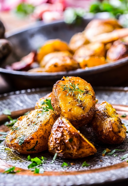 American roasted potatoes with smoked bacon garlic salt pepper cumin dill parsley  herb decoration