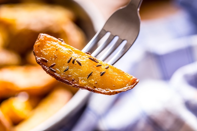 American roasted potatoon fork with smoked bacon garlic salt pepper cumin dill parsley