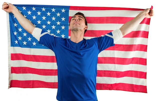 American soccer fan holding flag on white background