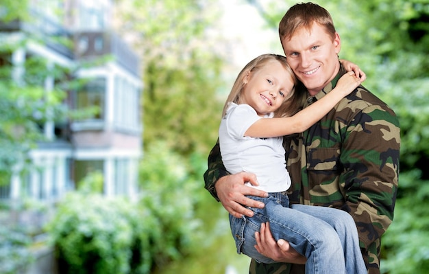 American soldier and son in a park