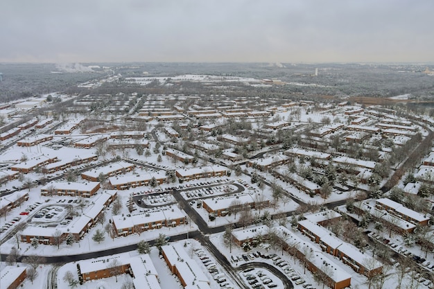 American town small apartment complex of a snowy winter on the residential streets after snowfall in winter landscape