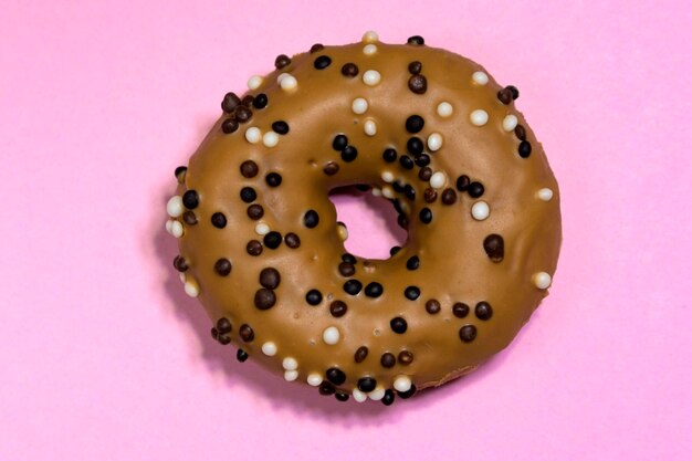 American traditional doughnut with sprinkles on a contrasting background