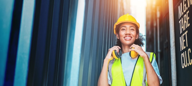 American women of color Work in an international shipping yard area Export and import delivery service with containers