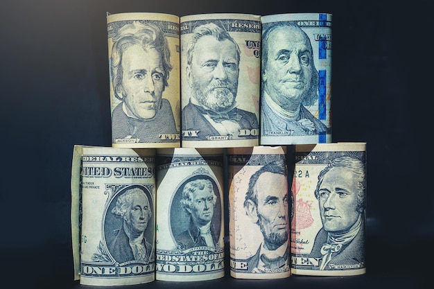 Americas Presidents on banknotes money stack on dark background Selected focus