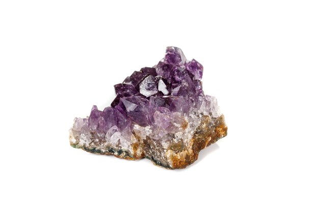 Photo amethyst crystal druse macro mineral on white background