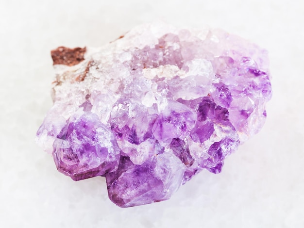 Amethyst crystal druse on white marble