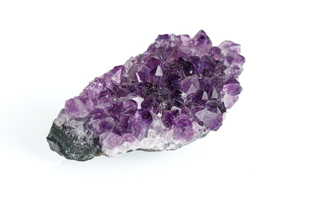 amethyst mineral stone macro on white background