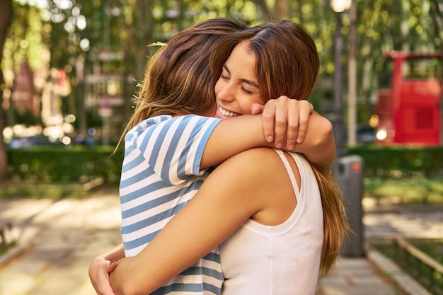 Amid nature's beauty happy friends embrace in a park