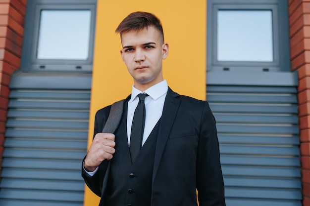 Amidst the hustle and bustle of the business world a young caucasian american man in a business suit