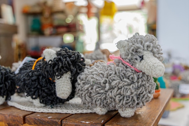 Photo amigurumi sheep in a fair stall