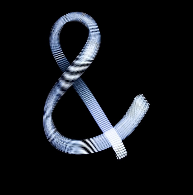 Фото Значок символа амперсанда с использованием техники рисования светом