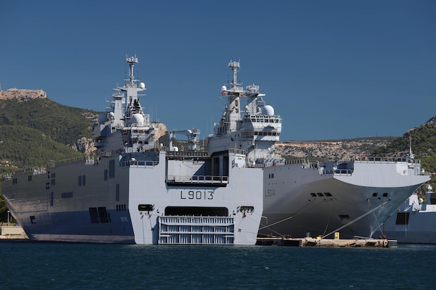 The amphibious assault ships le mistral and le tonnerre docked\
in the france navy base at the harbor of toulon france