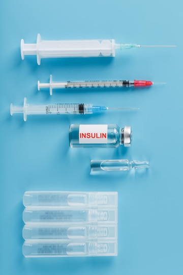 Premium Photo  Medicine in ampoules with insulin needles and