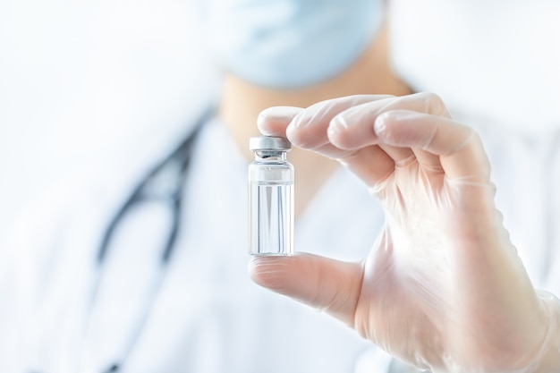 Ampoule of medicine in doctor's hand