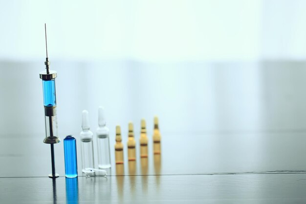 ampoules medicine vaccine concept, abstract background, vaccination virus protection