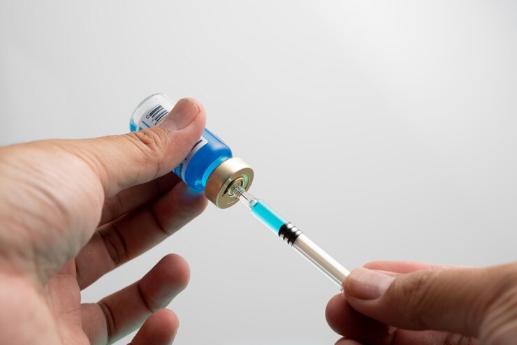 Photo ampoules or vials with covid-19 vaccine on a laboratory bench sars-cov-2 vaccination immunization
