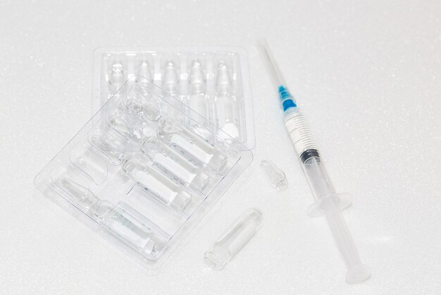 Ampoules with medicine and a syringe