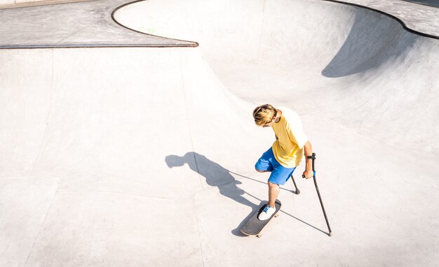 Amputated skater spending time at the skatepark. concept about disability and sports