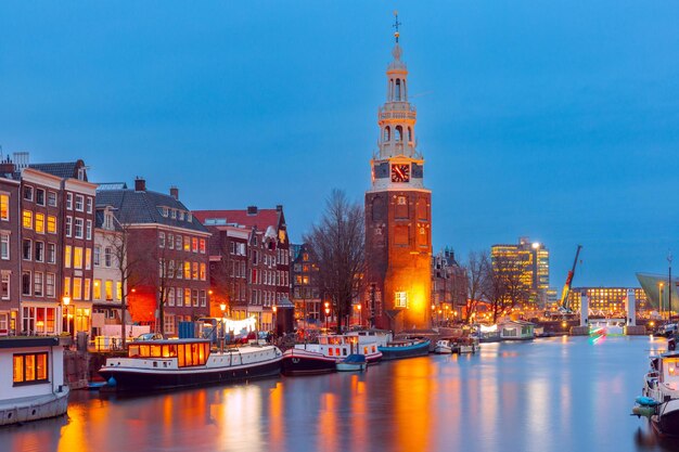 Photo amsterdam canal oudeschans and tower montelbaanstoren holland netherlands