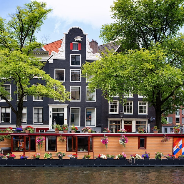 Amsterdam canal with houseboat