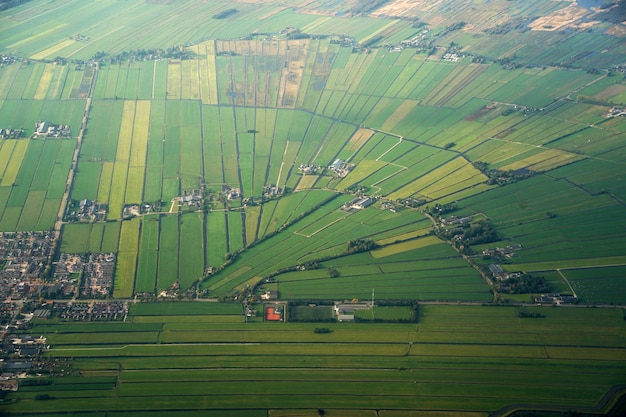 Amsterdam farmed fields aerial panorama landscape while landing