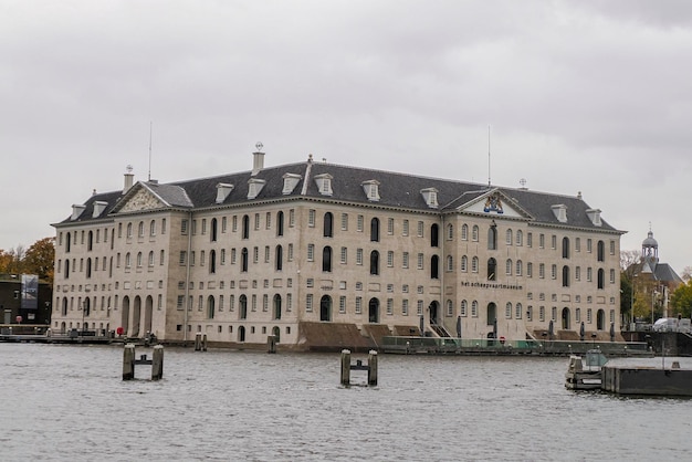 amsterdam maritime museum and cityscape on rainy day