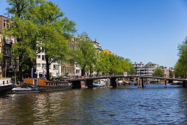 Amsterdam, Netherlands, Europe, September 1 2021 Traditional old narrow houses boats and canals in Amsterdam, the capital of the Netherlands.