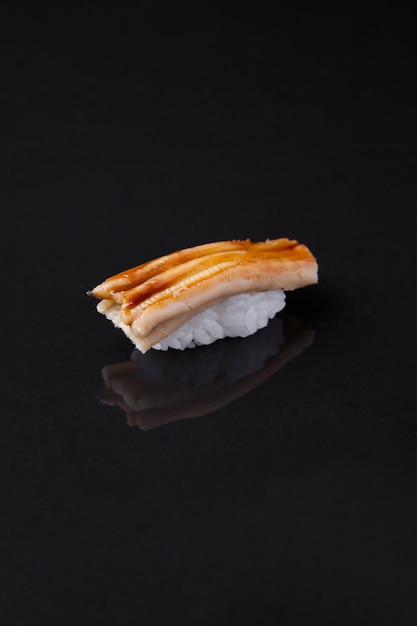 Anago sushi on a dark background