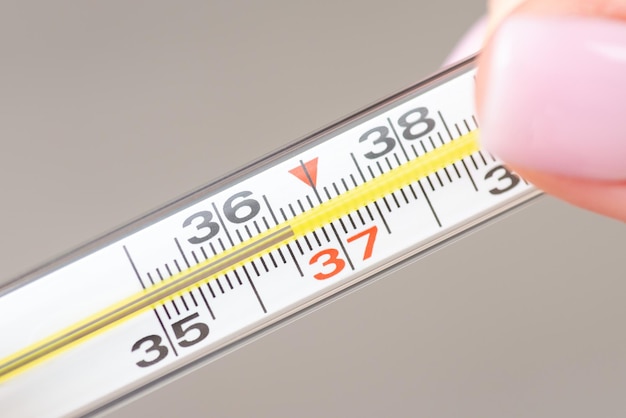 Analogue thermometer isolated on light grey background close up