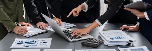 Photo analyst team analyzing business data paper on office table prodigy