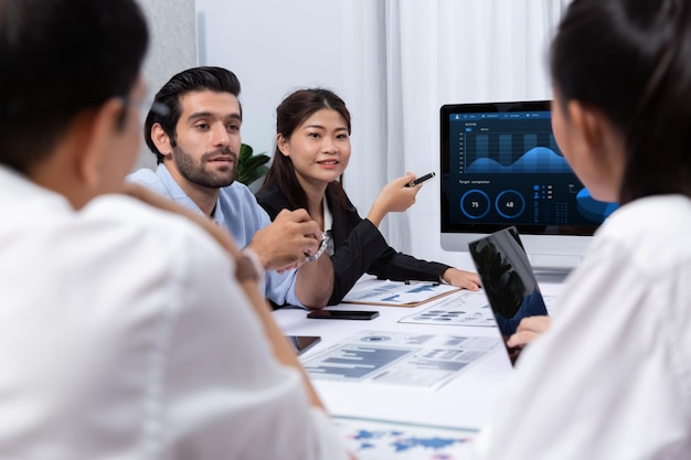 Analyst team utilizing BI Fintech to analyze financial data at table Prudent
