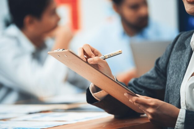 Photo analyst team writing and planning marketing using bi dashboard data to analyze financial report on meeting table business people utilize data analysis by fintech for business decision concord