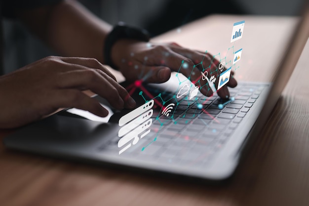 An analyst working with business analytics and a data management system on a laptop makes a report with KPIs and metrics connected to a database strategy for finance operations sales and marketing