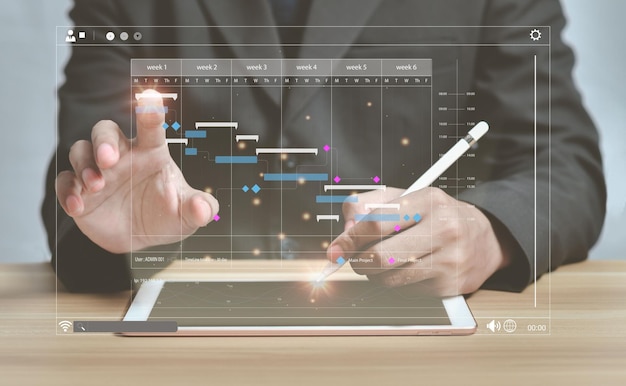 Foto analista che lavora con il tablet nel sistema di gestione dei dati e dell'analisi aziendale