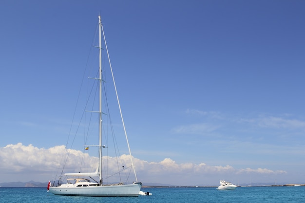 Anchored sailboat Formentera turquoise Illetes