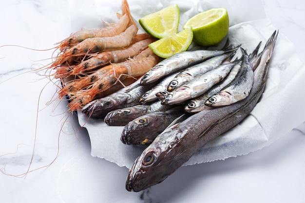 Anchovies, prawns and raw whiting prepared for frying