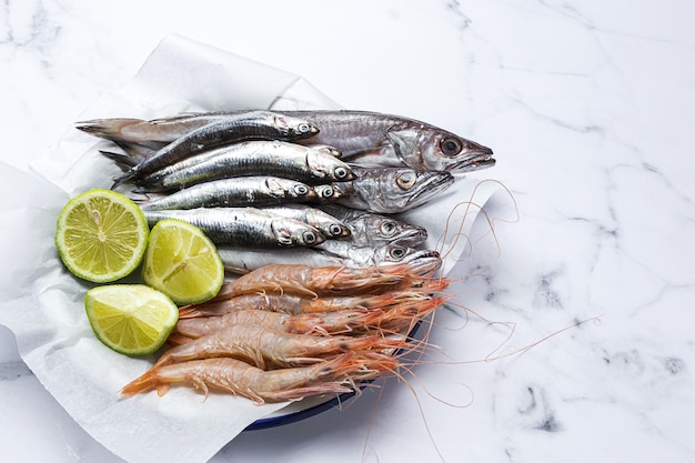 Anchovies, prawns and raw whiting prepared for frying