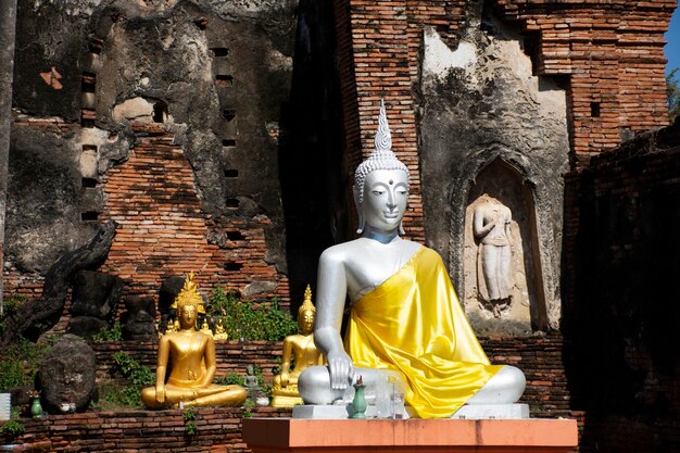 Ancient antique buddha statue ruins in Wat Choeng Tha pagoda or Koy Tha temple in Ayutthaya Thailand