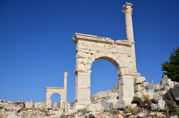 ancient arches of Sagalassos town with blue sky on backgrounds