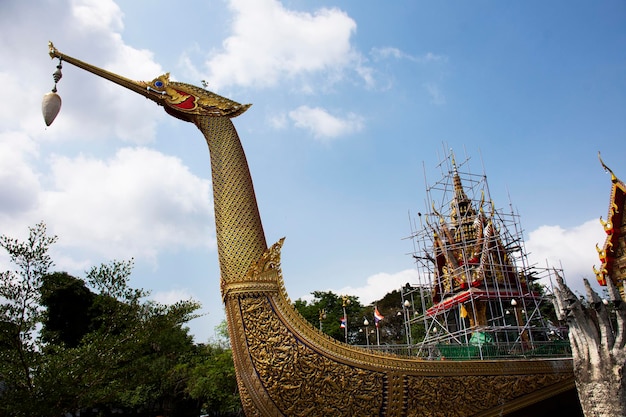 Ancient architecture Royal Barge Suphannahong sculptured boat and antique building ubosot for thai people traveler travel visit in Wat Chalor or Chalo temple at Bang Kruai city in Nonthaburi Thailand