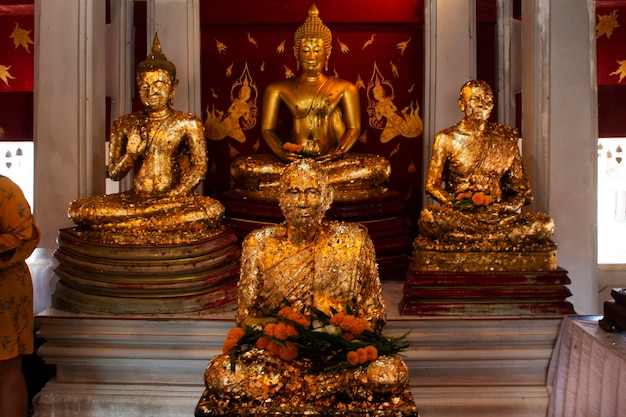 Ancient buddha and buddhist saint holy arhat or buddhism noble monk arahant statue of Wat Khao Din Temple for thai people travelers travel visit respect praying blessing wish at Suphan Buri Thailand