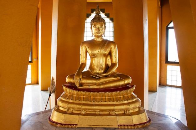 Ancient buddha statue in antique stupa Phra That Chedi Si Pho Thong of Wat Tha It temple for thai people travelers visit respect praying blessing wish mystery at Angthong city in Ang Thong Thailand