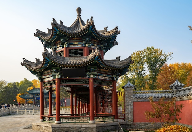 Ancient buildings and natural scenery in the park in autumn