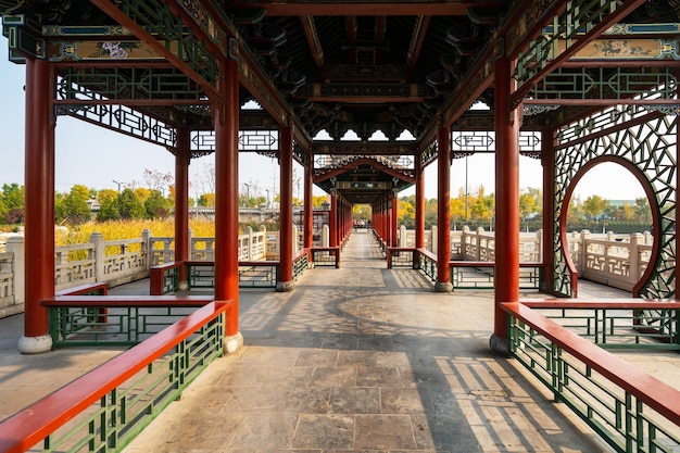 Ancient buildings and natural scenery in the park in autumn