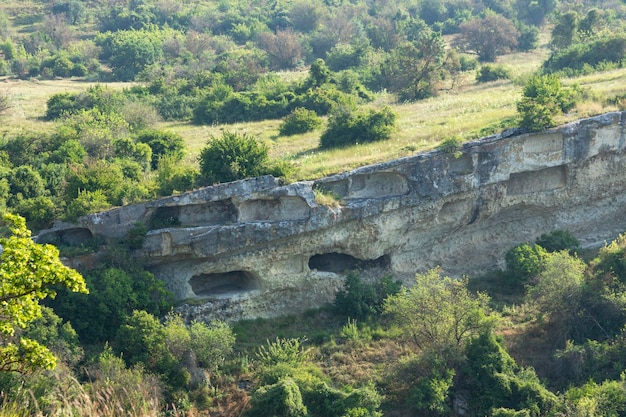 Ancient cave city Baqla View from the outside honeycomb weathering of rocks