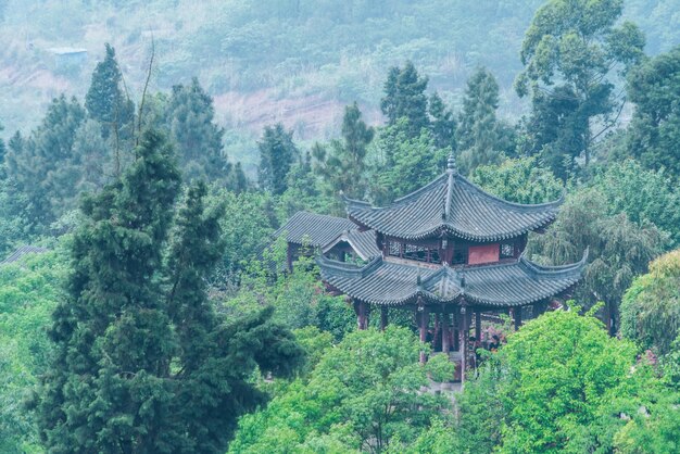 An ancient chinese pavilion in a mountainous area