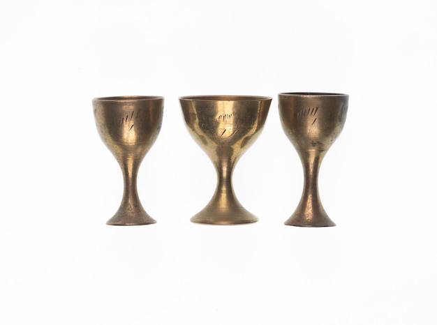 Photo ancient copper goblet for wine on a white background