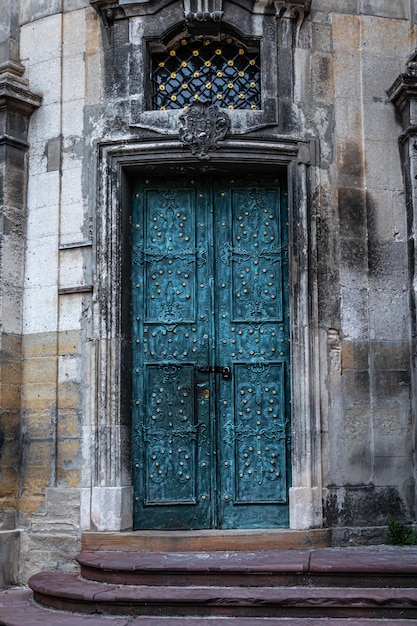 Ancient doors in the cathedral turquoise old doors