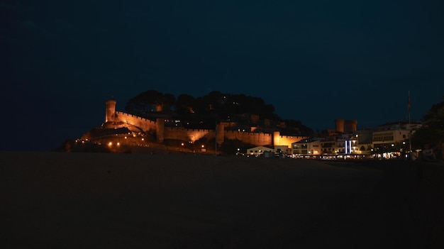 Ancient fortress on the coast Night Illuminated building